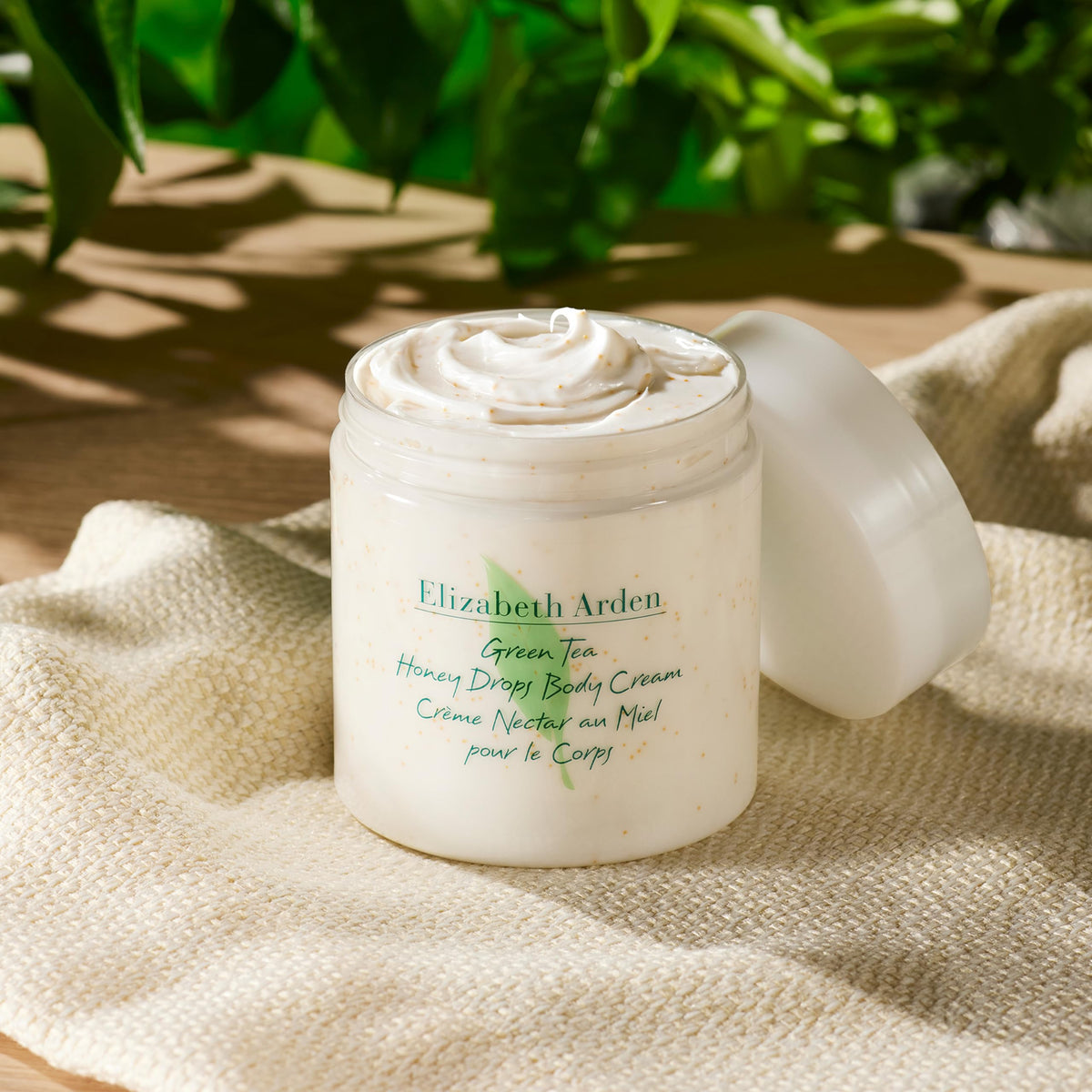 Elizabeth Arden cream applied to elbow showing targeted moisturizing effect