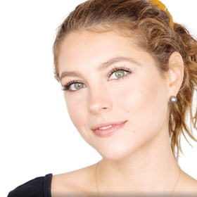Elizabeth Mott applying bronzer to cheek demonstrating contouring and warm glow