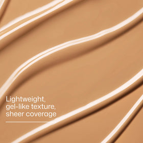 EltaMD applied outdoors by beach showing sun protection and lightweight wear