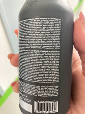 EMAX label close-up highlighting ingredients and nanoplastia benefits for hair