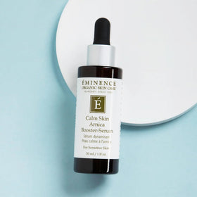 Eminence 1 oz bottle next to a coin, size and travel-friendly convenience benefit