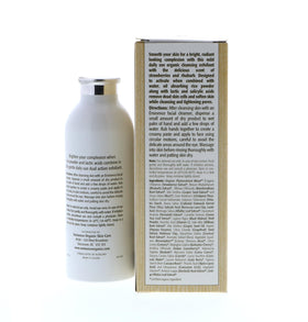 Lifestyle shot of unisex user applying product showing gentle exfoliation