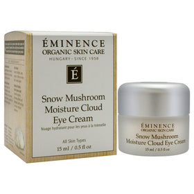 Eminence eye cream in hand scale demonstrating compact 0.5 fl oz size and travel-friendly convenience