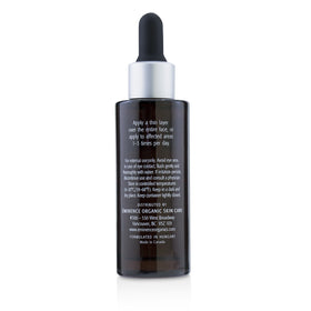 Eminence serum being applied to cheek in lifestyle setting demonstrating visible smoothing benefit