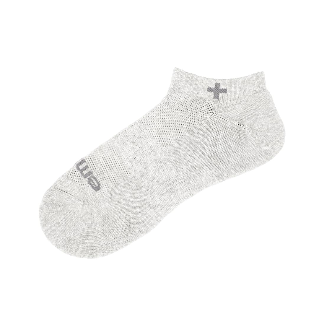 emuaid socks worn on foot in home setting showing moisture control benefit