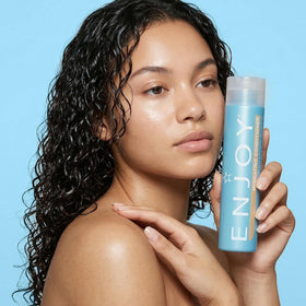 Enjoy hydrating conditioner on bathroom shelf lifestyle shot conveying everyday luxury