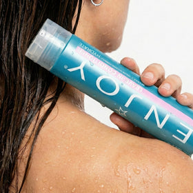 Enjoy conditioner on bathroom shelf suggesting daily routine benefit