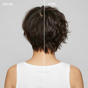 Model applying Enjoy molding paste to hair showing flexible hold and defined texture benefit
