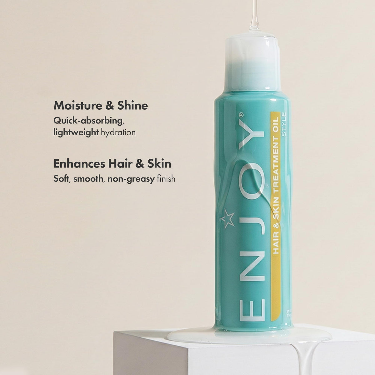 Enjoy oil pour close-up displaying silky texture and fast-absorbing finish benefit