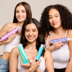 Enjoy shampoo on a bathroom shelf in lifestyle setting conveying daily-use and refresh ritual