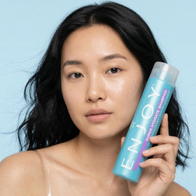Enjoy shampoo on bathroom shelf styled with towel for routine