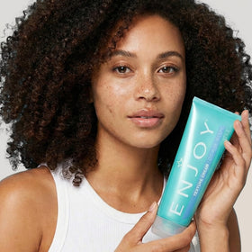 Enjoy model with tousled hair illustrating natural texture and anti-frizz control