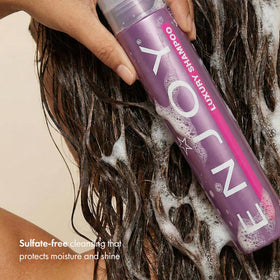 Enjoy shampoo texture cream on palm illustrating gentle lather and hydration