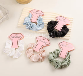 EOLUCC diamond card detail with scrunchie, polished presentation benefit