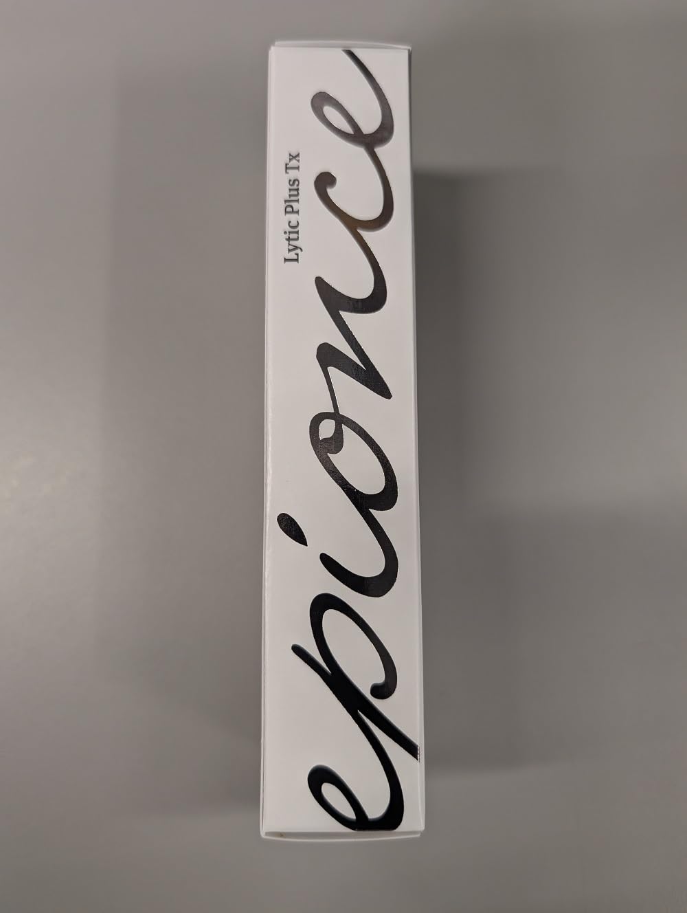 Epionce Lytic Tx in hand to show size and travel-friendly benefit