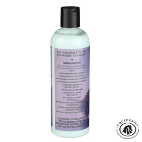 EQUIDERMA 16 oz beside hands showing portable grooming benefit