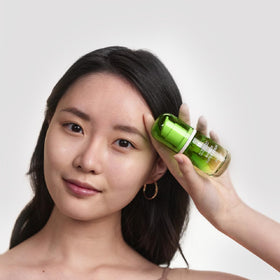 Erborian Bamboo Super Serum next to a ruler to show 1 fl oz size and travel-friendliness