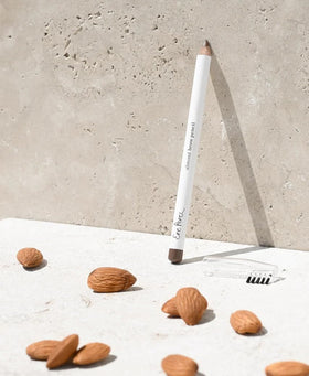 Ere Perez product and ingredient flatlay featuring almond and coconut oils nourishment