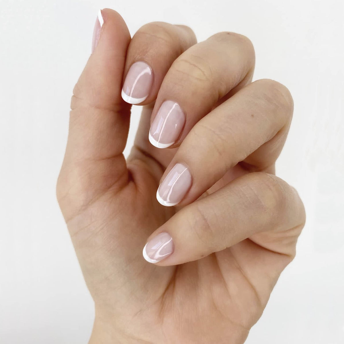 essie Blanc bottle close-up shows opaque white pigment for crisp tip contrast