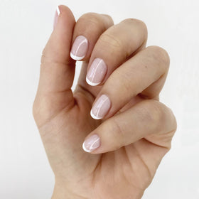 essie Blanc bottle close-up shows opaque white pigment for crisp tip contrast