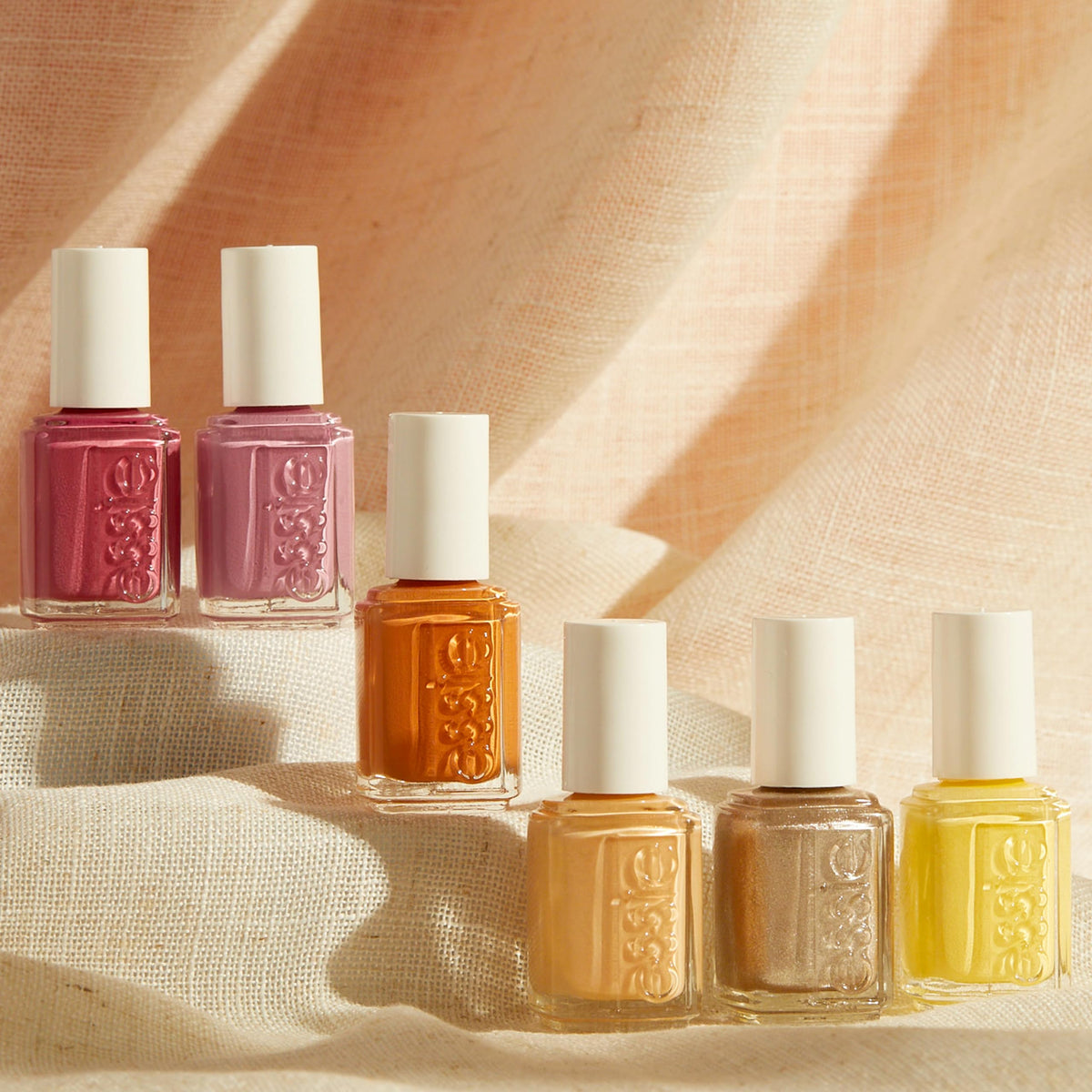 essie bottle held to show 0.46 fl oz scale and portability