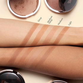 Estée Lauder bronzer applied with brush demonstrating buildable, blendable coverage