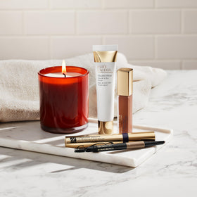 Estée Lauder spoolie brush in use grooming brows for polished, long-lasting shape benefit