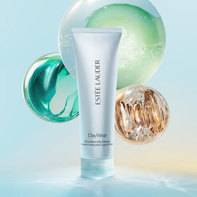 Estée Lauder product in hand showing 4.2 fl oz scale and travel-friendly size