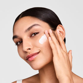 Estée Lauder cream being smoothed on skin demonstrating lightweight hydration and finish