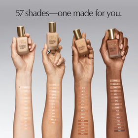 Estée Lauder bottle beside a ruler showing 1 fl oz size and travel-friendly benefit