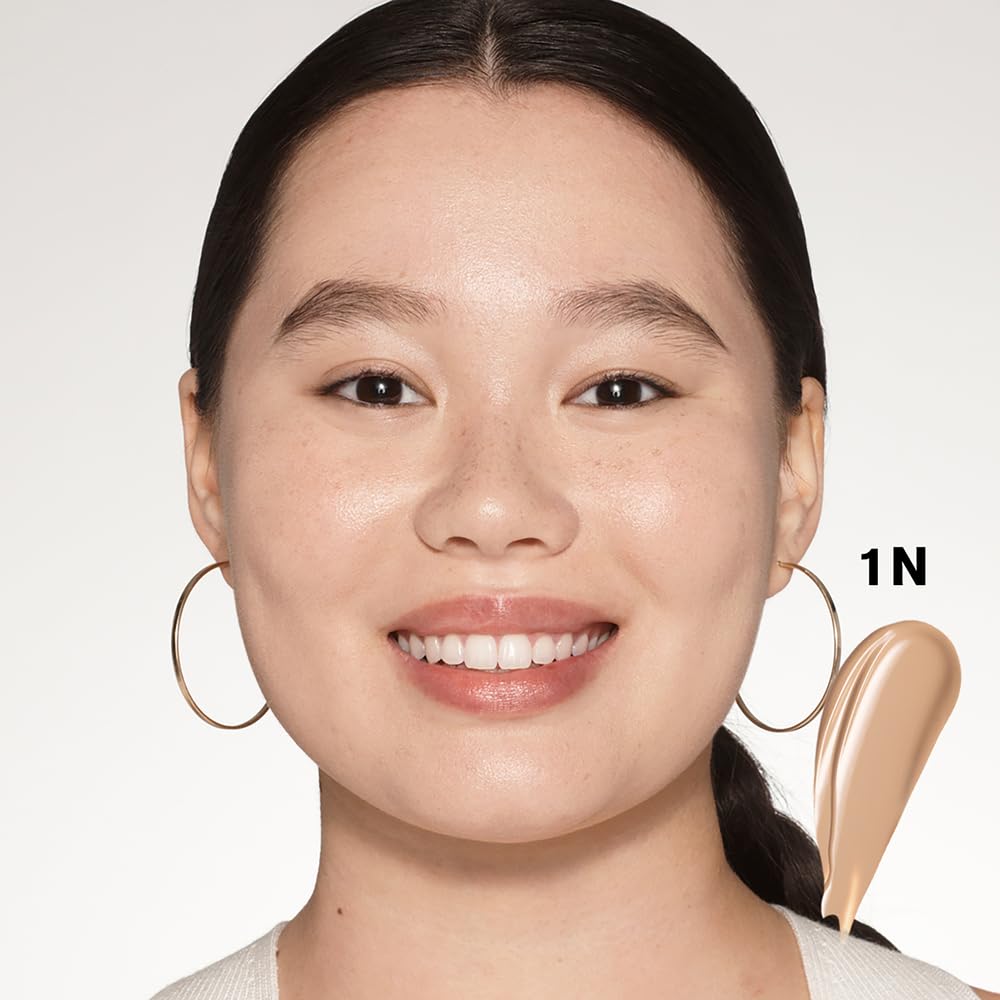 Estée Lauder Futurist 1N shade shown near scale to display true color match