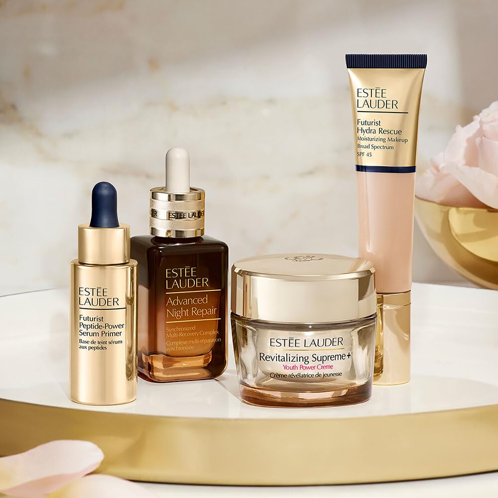 Estée Lauder Futurist scale comparison bottle beside everyday items to show compact travel size