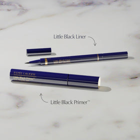 Estée Lauder little black primer brush close-up showing bristles that separate lashes for precise application