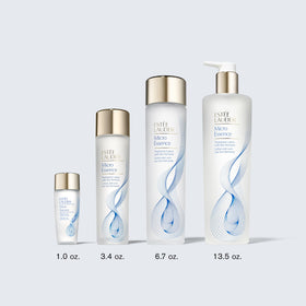 Estée Lauder bottle in hand to show travel-size scale and on-the-go convenience