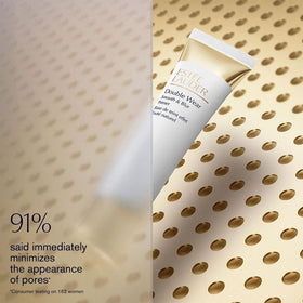 Estée Lauder primer applied on skin in hand showing pore-blurring effect benefit