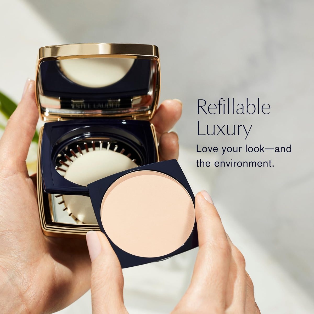 Estée Lauder refill beside coin for scale illustrating compact replacement simplicity and portability