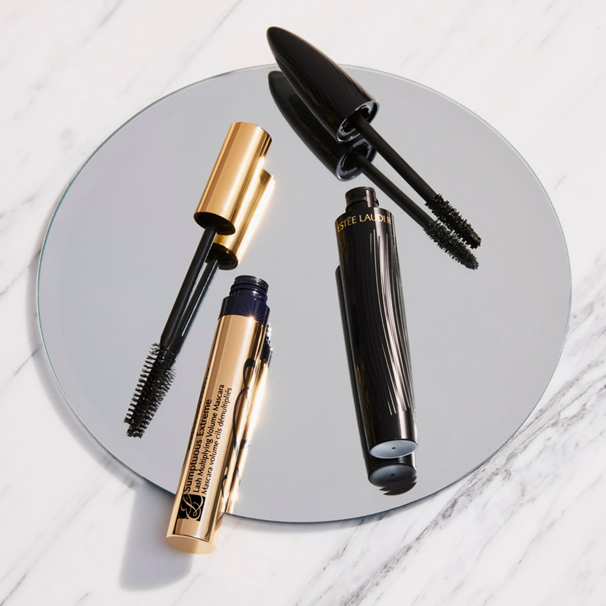 Estée Lauder tube held in hand demonstrating compact 0.27 fl oz size
