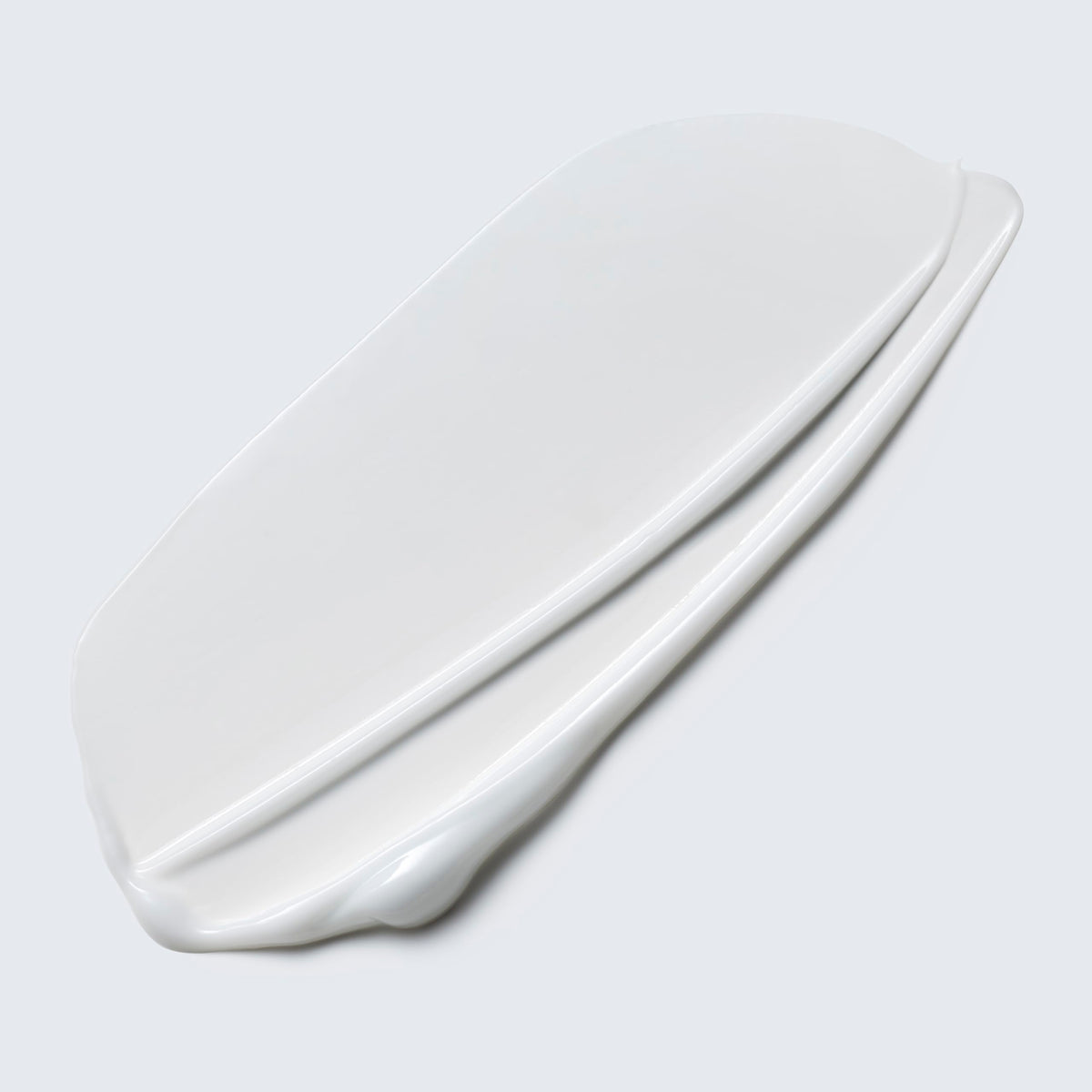 Estée Lauder lotion texture close-up showing lightweight formula and easy rinse