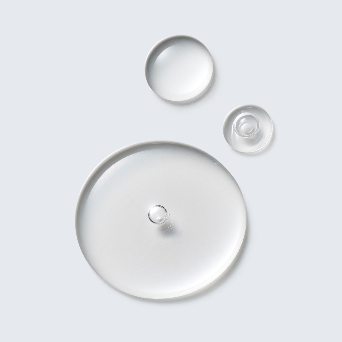 Estée Lauder texture on cotton pad showing lightweight liquid and easy application benefit
