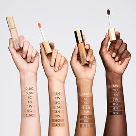 Estée Lauder coverage swatches on arm illustrating buildable medium-to-full coverage