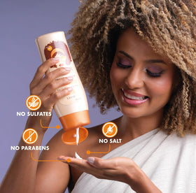 ETNIKER label ingredient panel highlighting natural oils and protein benefits for curls