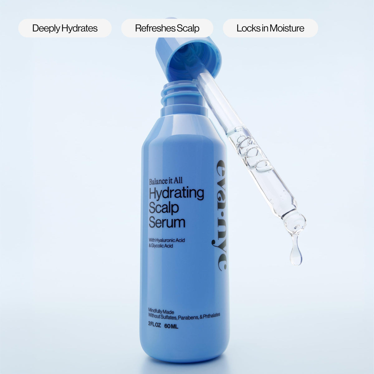 EVA·NYC applying serum to fingertips for scalp massage, aids targeted hydration