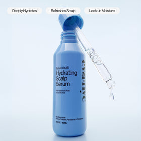 EVA·NYC applying serum to fingertips for scalp massage, aids targeted hydration