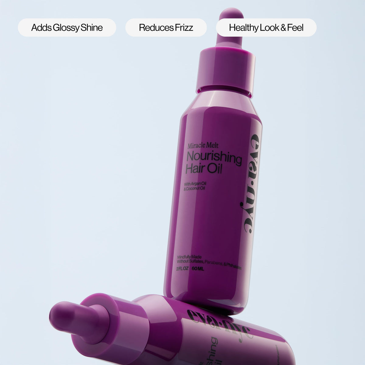 EVA·NYC 2 fl oz bottle in hand showing compact travel convenience