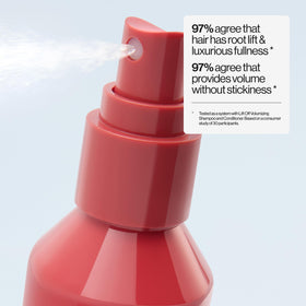 EVA·NYC spray texture on hair strand illustrating thicker-looking finish