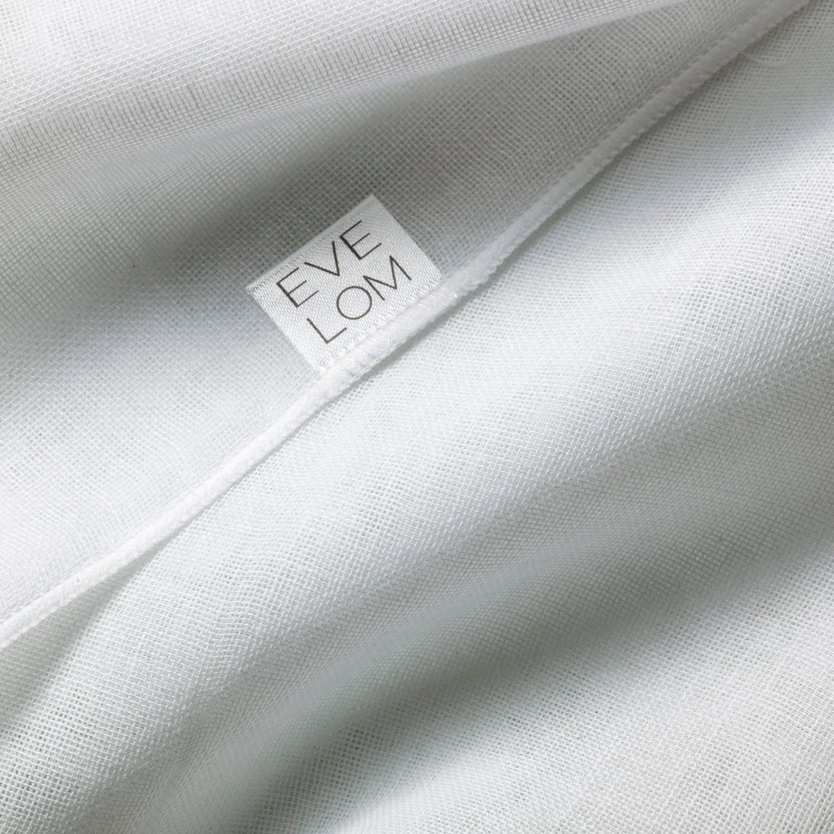 EVE LOM cloth in hand removing cleanser demonstrating effective residue removal