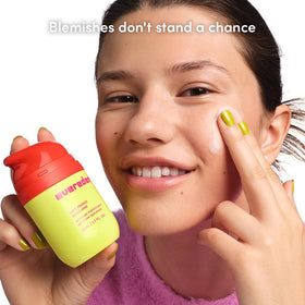 Teen applying Evereden moisturizer in the morning for calm, non-greasy skin