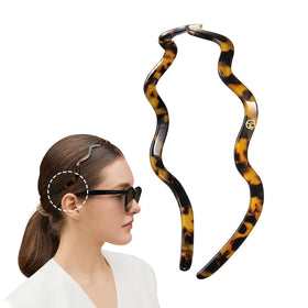 EVITA PERONI front view tortoise headband showing slim profile and style