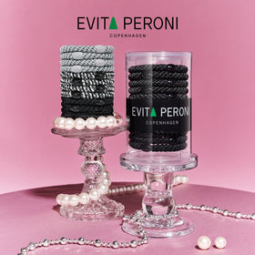 EVITA PERONI used in a high ponytail demonstrating secure hold during activity