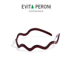 EVITA PERONI lifestyle image of woman wearing headband for all-day comfort